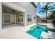 A lovely backyard pool and patio area is perfect for outdoor entertaining and relaxation at 7508 Lake Albert Dr, Windermere, FL 34786