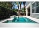 A sparkling backyard pool with a charming waterfall feature and meticulously kept landscaping at 7508 Lake Albert Dr, Windermere, FL 34786
