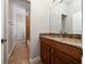 Bathroom featuring a vanity with a granite countertop, toilet, and shower at 7508 Lake Albert Dr, Windermere, FL 34786