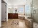 The bright bathroom features a soaking tub, a walk-in shower, and double sinks at 7508 Lake Albert Dr, Windermere, FL 34786