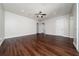 The bedroom has hardwood flooring, a ceiling fan, and neutral paint at 7508 Lake Albert Dr, Windermere, FL 34786