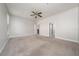 Large bedroom with carpet, ceiling fan, and natural light from a window at 7508 Lake Albert Dr, Windermere, FL 34786