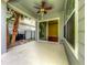 This home features a covered patio with ceiling fan and a large sliding door for easy indoor/outdoor living at 7508 Lake Albert Dr, Windermere, FL 34786