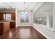 Open dining room with hardwood floors, natural light, and decorative hanging light at 7508 Lake Albert Dr, Windermere, FL 34786