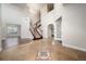 Elegant foyer with soaring ceilings, wood staircase, and tiled flooring at 7508 Lake Albert Dr, Windermere, FL 34786