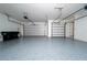 This spacious garage includes epoxy floors and dual doors for convenient parking and storage at 7508 Lake Albert Dr, Windermere, FL 34786