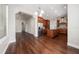 Open kitchen and living area with dark hardwood floors and stainless steel appliances at 7508 Lake Albert Dr, Windermere, FL 34786