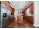 Spacious kitchen with stainless appliances, island, hardwood floors and ample cabinetry at 7508 Lake Albert Dr, Windermere, FL 34786