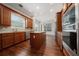 Well-equipped kitchen with island, stainless steel appliances, and a seamless flow to dining area at 7508 Lake Albert Dr, Windermere, FL 34786