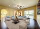Spacious living room offering generous seating options and views of the pool at 7508 Lake Albert Dr, Windermere, FL 34786