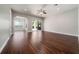 The living room features hardwood flooring, ceiling fan, and sliding glass doors at 7508 Lake Albert Dr, Windermere, FL 34786