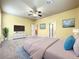 Generously sized main bedroom providing ample space, a ceiling fan, and natural light at 7508 Lake Albert Dr, Windermere, FL 34786