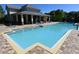 Community pool with zero entry and brick paver decking, perfect for relaxing and enjoying the Florida sunshine at 7508 Lake Albert Dr, Windermere, FL 34786