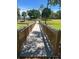 Scenic wooden walkway through the community's green spaces, perfect for a relaxing stroll at 7508 Lake Albert Dr, Windermere, FL 34786
