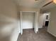 Bedroom with walk-in closet, ceiling fan, and carpet at 9650 Nw Gainesville Rd, Ocala, FL 34475