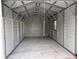 Spacious metal garage with ample room for storage or a workshop on a concrete slab at 9650 Nw Gainesville Rd, Ocala, FL 34475