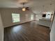 Bright living room boasts modern flooring, vaulted ceilings, and natural light from multiple windows at 9650 Nw Gainesville Rd, Ocala, FL 34475