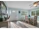 Casual dining area with a round wooden table and white chairs at 110 Surf St, New Smyrna Beach, FL 32169