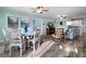 Bright dining area featuring a round wooden table and four chairs at 110 Surf St, New Smyrna Beach, FL 32169