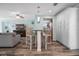 Open concept dining area with wooden table and chairs at 110 Surf St, New Smyrna Beach, FL 32169