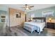 Main bedroom with large closet, king bed, and wood flooring at 110 Surf St, New Smyrna Beach, FL 32169