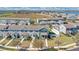 Aerial view of townhomes in a well-planned community, highlighting the neighborhood layout near the water at 514 Rainbow Springs Loop, Groveland, FL 34736