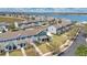 An aerial view of a townhouse community near a picturesque lake at 514 Rainbow Springs Loop, Groveland, FL 34736