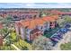 Aerial view of apartment building with ample parking at 5512 Metrowest Blvd # 110, Orlando, FL 32811