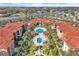 Aerial view of community pool and surrounding condo buildings at 5512 Metrowest Blvd # 110, Orlando, FL 32811