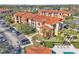 Aerial view of apartment building with parking and pool at 5512 Metrowest Blvd # 110, Orlando, FL 32811