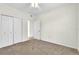 Spacious bedroom with double door closet and carpet at 5512 Metrowest Blvd # 110, Orlando, FL 32811