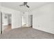 Spacious bedroom with ceiling fan and carpet at 5512 Metrowest Blvd # 110, Orlando, FL 32811