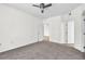 Bright bedroom with ceiling fan and carpet at 5512 Metrowest Blvd # 110, Orlando, FL 32811