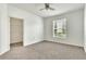 Spacious bedroom with ceiling fan and walk-in closet at 5512 Metrowest Blvd # 110, Orlando, FL 32811