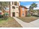 Condo building entryway with landscaping and walkway at 5512 Metrowest Blvd # 110, Orlando, FL 32811