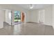 Spacious living room with tile floors and access to a bedroom and patio at 5512 Metrowest Blvd # 110, Orlando, FL 32811