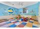 playroom with tables, chairs, and ocean mural at 5512 Metrowest Blvd # 110, Orlando, FL 32811