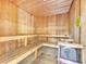 Community sauna with wooden benches and walls at 5512 Metrowest Blvd # 110, Orlando, FL 32811