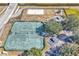 Aerial view of tennis court, playground, and sand volleyball court at 5512 Metrowest Blvd # 110, Orlando, FL 32811