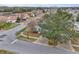 Aerial view of house and neighborhood with tree and street at 6621 Bouganvillea Crescent Dr, Orlando, FL 32809