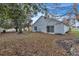 House exterior and backyard view with mature trees at 6621 Bouganvillea Crescent Dr, Orlando, FL 32809