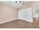 Spacious bedroom with double door closet and wood-look floors at 6621 Bouganvillea Crescent Dr, Orlando, FL 32809