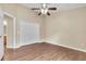 Bedroom with double door closet and wood-look floors at 6621 Bouganvillea Crescent Dr, Orlando, FL 32809