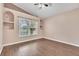 Bedroom with built-in shelves and wood-look floors at 6621 Bouganvillea Crescent Dr, Orlando, FL 32809