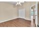 Bright bedroom with double door closet and wood-look floors at 6621 Bouganvillea Crescent Dr, Orlando, FL 32809