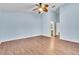 Large bedroom with light blue walls and wood-look floors at 6621 Bouganvillea Crescent Dr, Orlando, FL 32809