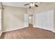 Spacious bedroom with double door closet and wood-look floors at 6621 Bouganvillea Crescent Dr, Orlando, FL 32809