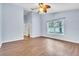 Light blue walls and wood-look floors in this bright bedroom at 6621 Bouganvillea Crescent Dr, Orlando, FL 32809