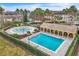 Community pool and splash pad with adjacent covered pavilion at 6621 Bouganvillea Crescent Dr, Orlando, FL 32809