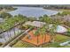 Community pool, playground, and clubhouse with lake views at 6621 Bouganvillea Crescent Dr, Orlando, FL 32809